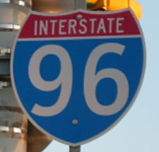 An image of a Interstate marker is shown using the alternative letter style to display the numerals.